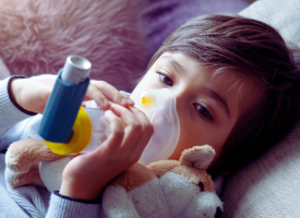 Child uses inhaler