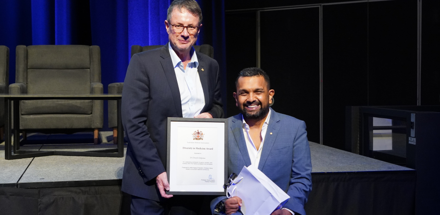 AMA President Professor Stephen Robson presenting the award to Dr Dinesh Palipana