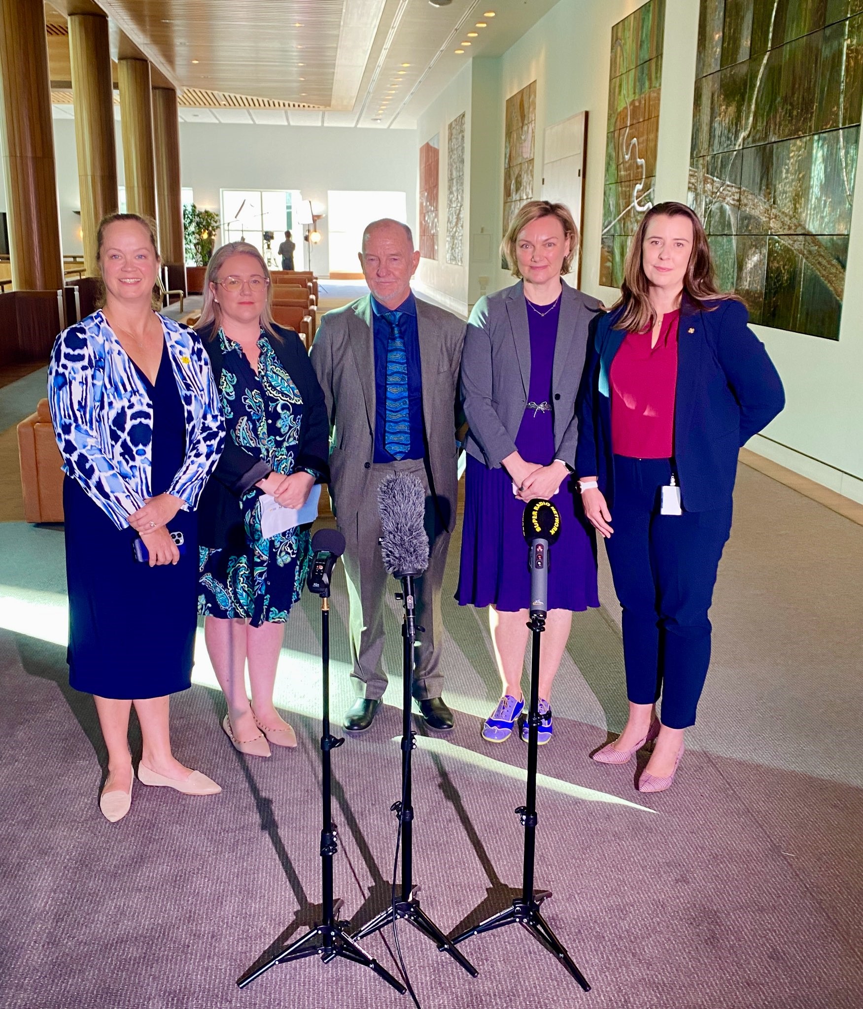 Dr Danielle McMullen with other public health leaders at a press conference in Mural Hall, Australian Parliament House