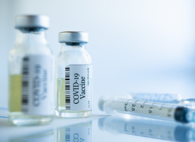 Vaccine bottles and syringe 