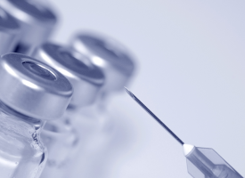 Vaccine bottles and syringe 