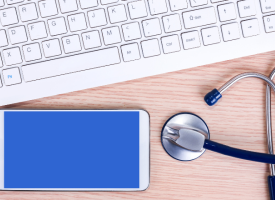 Image of laptop, mobile phone and stethoscope