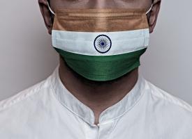 man wearing facemask with Indian flag print
