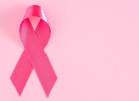 breast cancer ribbon on pink background