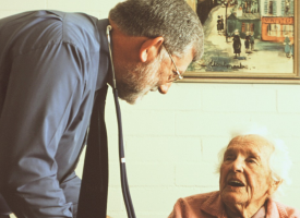 GP talking to aged care resident