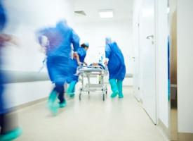 hospitals workers rushing down corridor