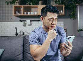 Stock image of person looking at phone