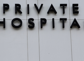  'Private Hospital' sign on wall of hospital 