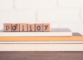 Policy word represented by blocks on a table