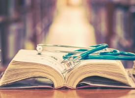 textbooks and a stethoscope 