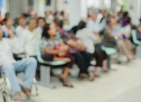 Blurred image of people in hospital waiting room