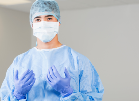 Surgeon wearing scrubs and gloves