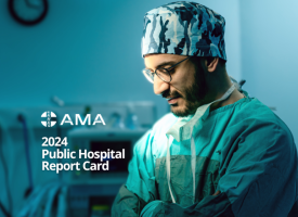 Surgeon with arms crossed on the cover of the AMA 2024 Public Hospital Report Card