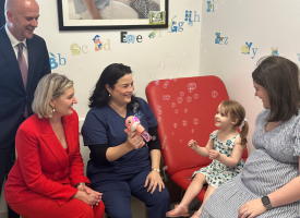 Chief Health Officer Dr John Gerrard, Health Minister Shannon Fentiman, AMA Queensland Past President Dr Maria Boulton, and mum Rachel with daughter Vivienne