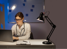 Image of doctor working on laptop