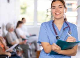 Image of healthcare worker in waiting room with patients