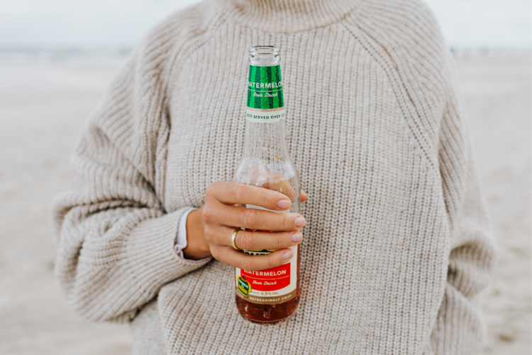 Woman holding an alcoholic beverage