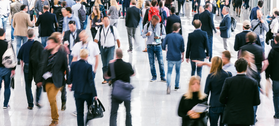 Blurred figures in a crowd