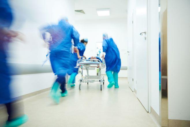 hospitals workers rushing down corridor