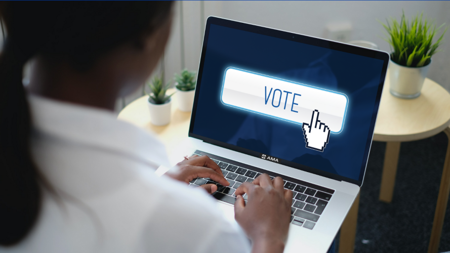 A woman votes on her laptop