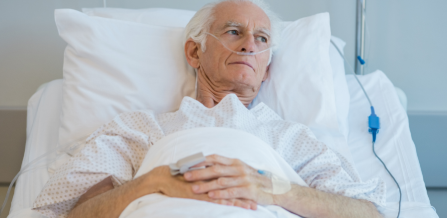 Older white man in hospital bed 