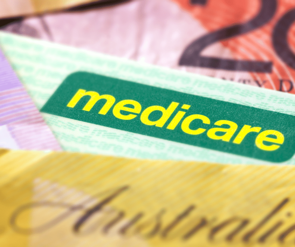 Medicare card with $50 note