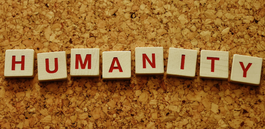 the word humanity written on blocks in red ink 