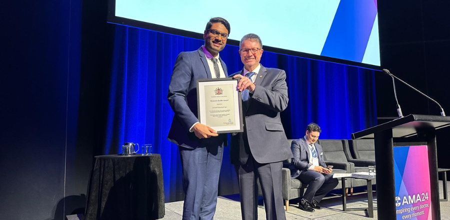 Professor Stephen Robson presenting the AMA Women's Health Award to Dr Keeth Mayakaduwage